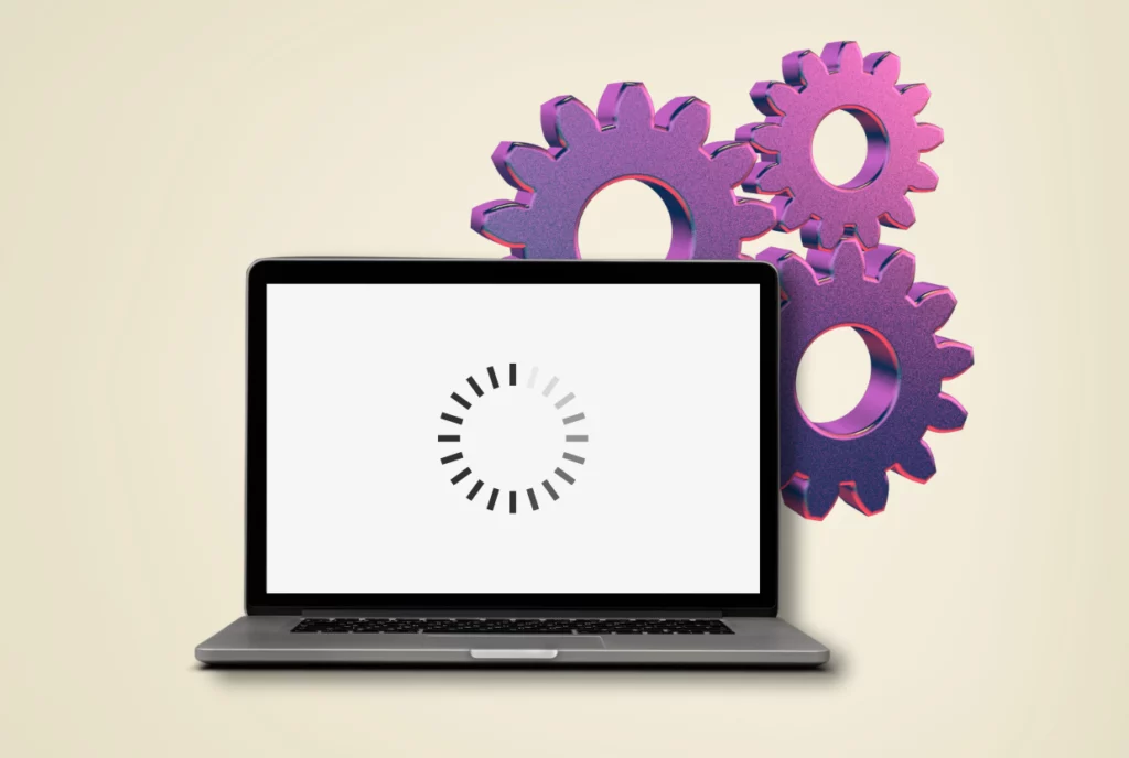 Ordinateur portable affichant un symbole de chargement devant des engrenages, illustrant un site lent et les optimisations de performance SEO (perfoséos).